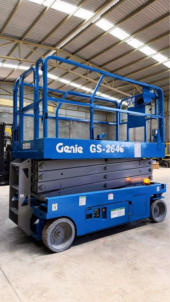 Blue Genie GS-2646 scissor lift parked in an industrial warehouse setting.